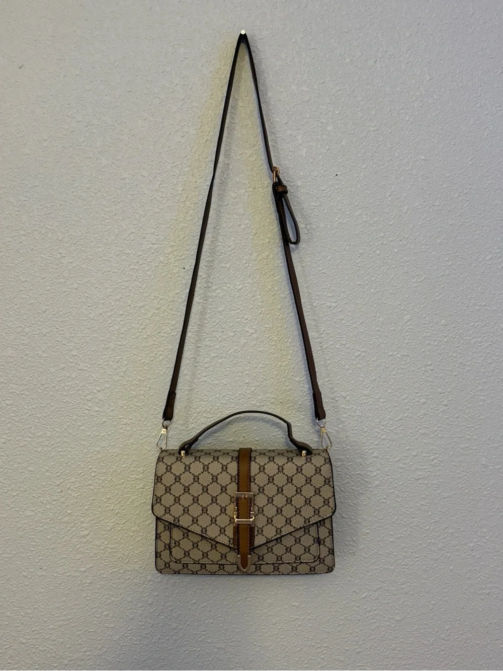 Beige Brown Monogram Shoulder Bag with Gold Buckle with a matching wallet.